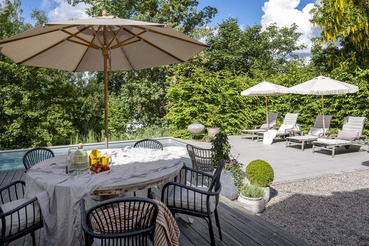 A White Swedish Villa with a Veranda and a Swimming Pool 30 swedish villa garden swimming pool