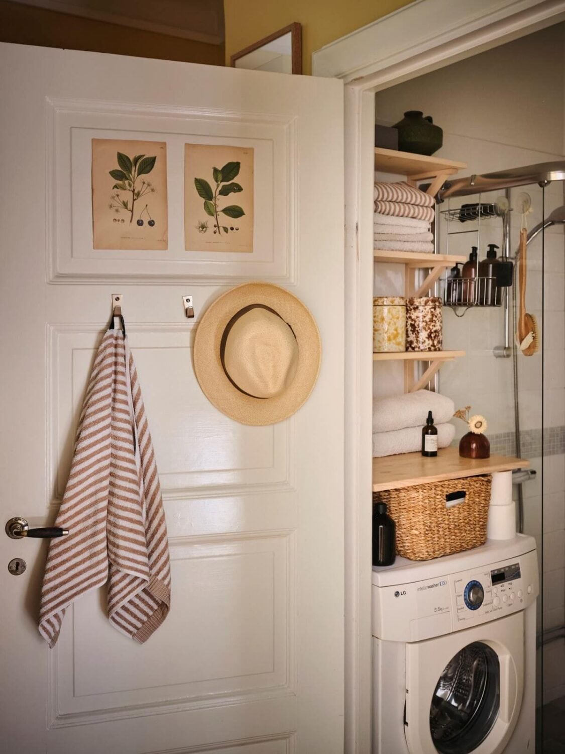 Muted Gray, Green, and Yellow Walls in a Stockholm Apartment 16 tiny bathroom with washing machine and storage shelves nordroom