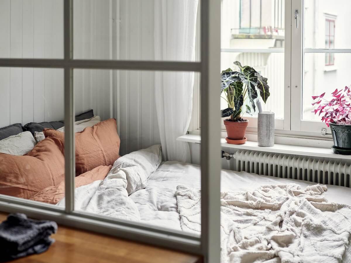 A Small Apartment with a Bright Open-Plan Kitchen & Bedroom 7 tiny bedroom off kitchen