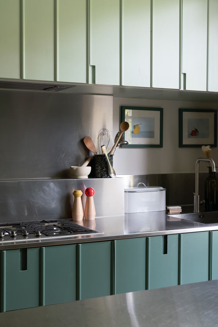 A Beautiful London Family Home with Colorful Accents 7 two green tone kitchen cabinets nordroom