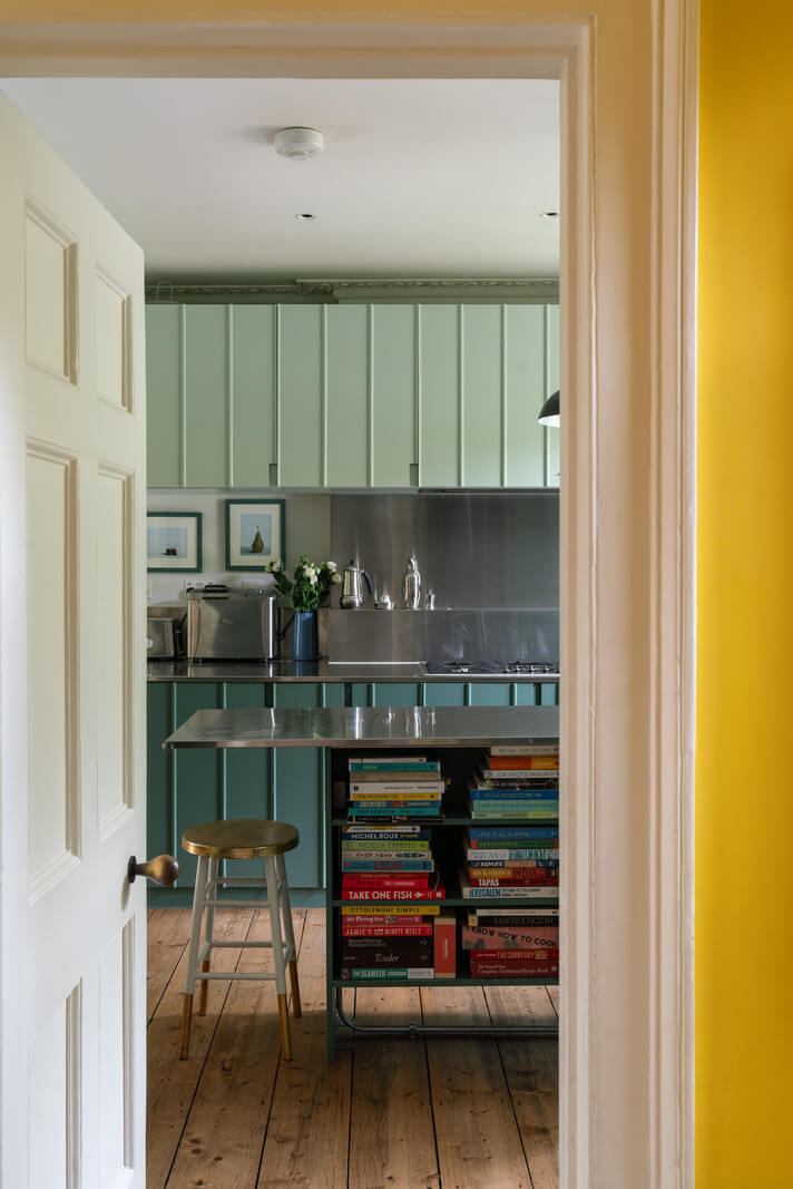 A Beautiful London Family Home with Colorful Accents 6 two tone green kitchen cabinets nordroom