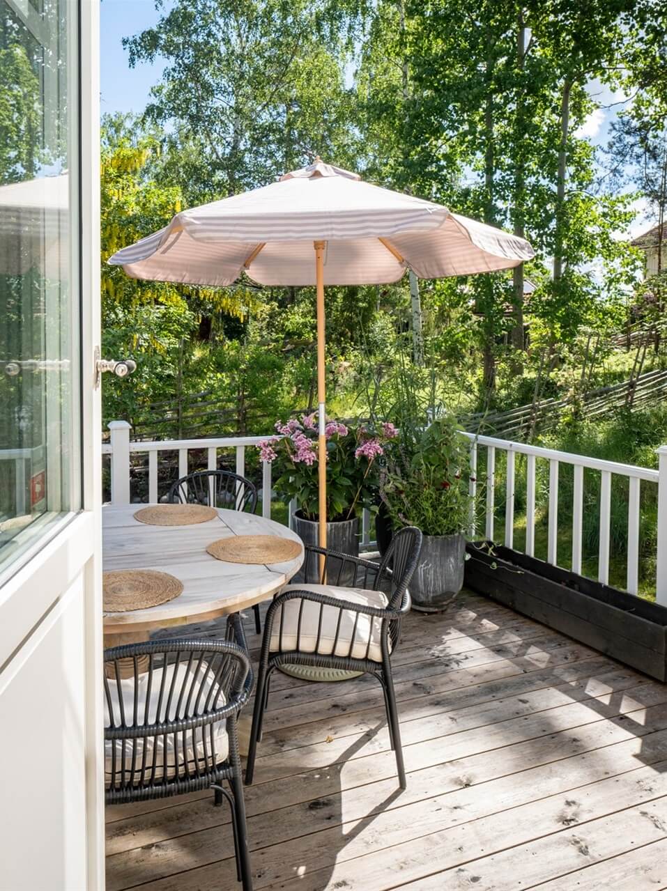 A White Swedish Villa with a Veranda and a Swimming Pool 33 veranda dining table nordroom