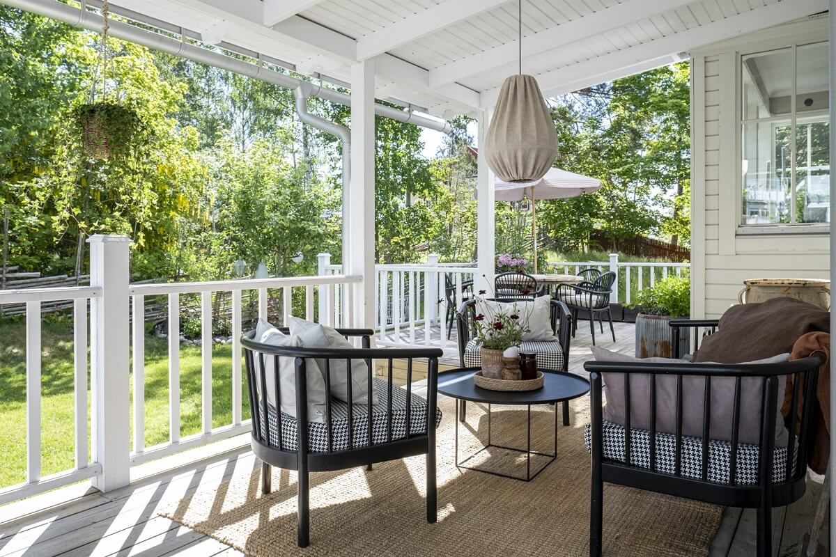 A White Swedish Villa with a Veranda and a Swimming Pool 34 veranda seating white swedish villa nordroom
