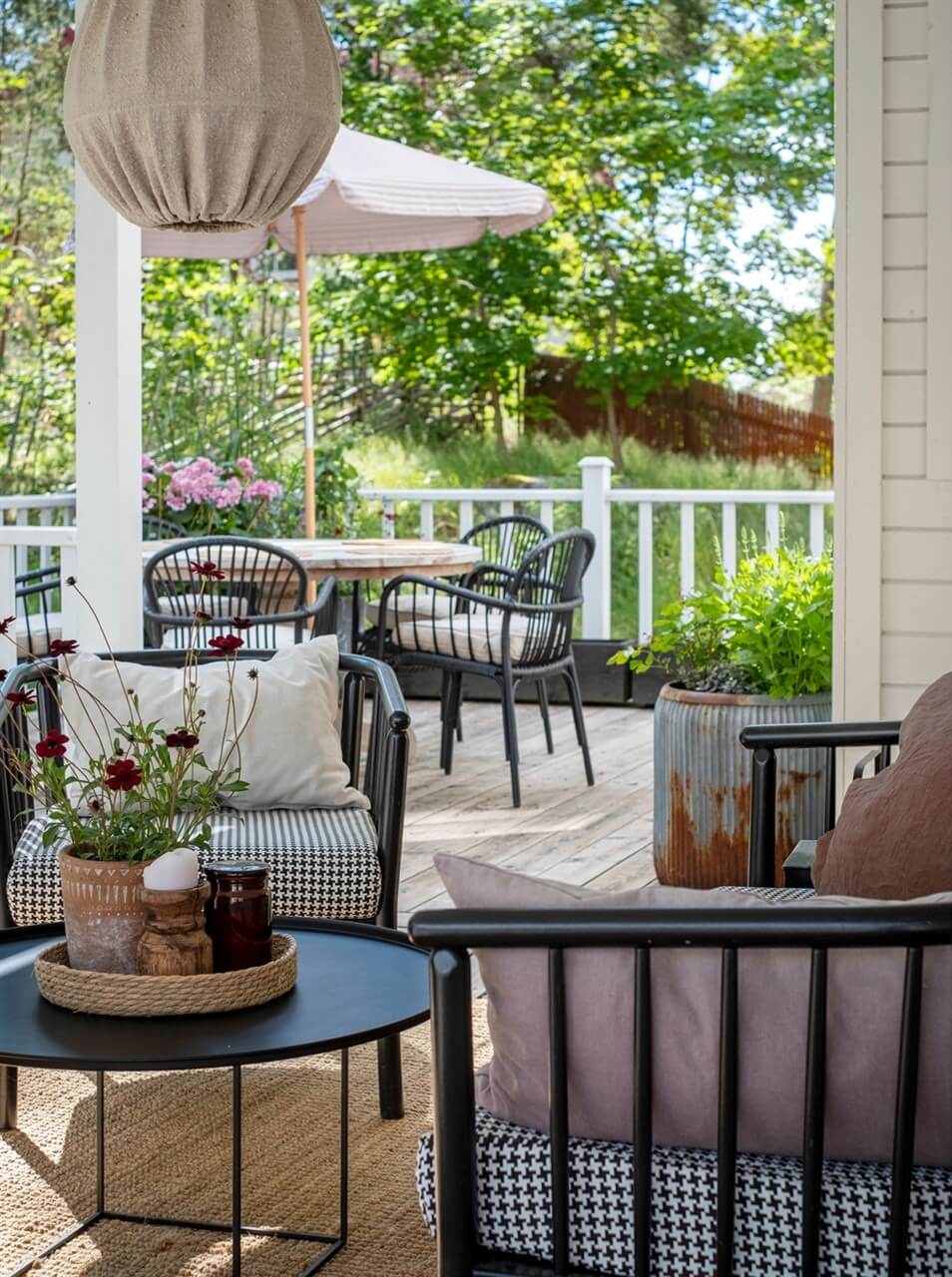A White Swedish Villa with a Veranda and a Swimming Pool 31 veranda seating