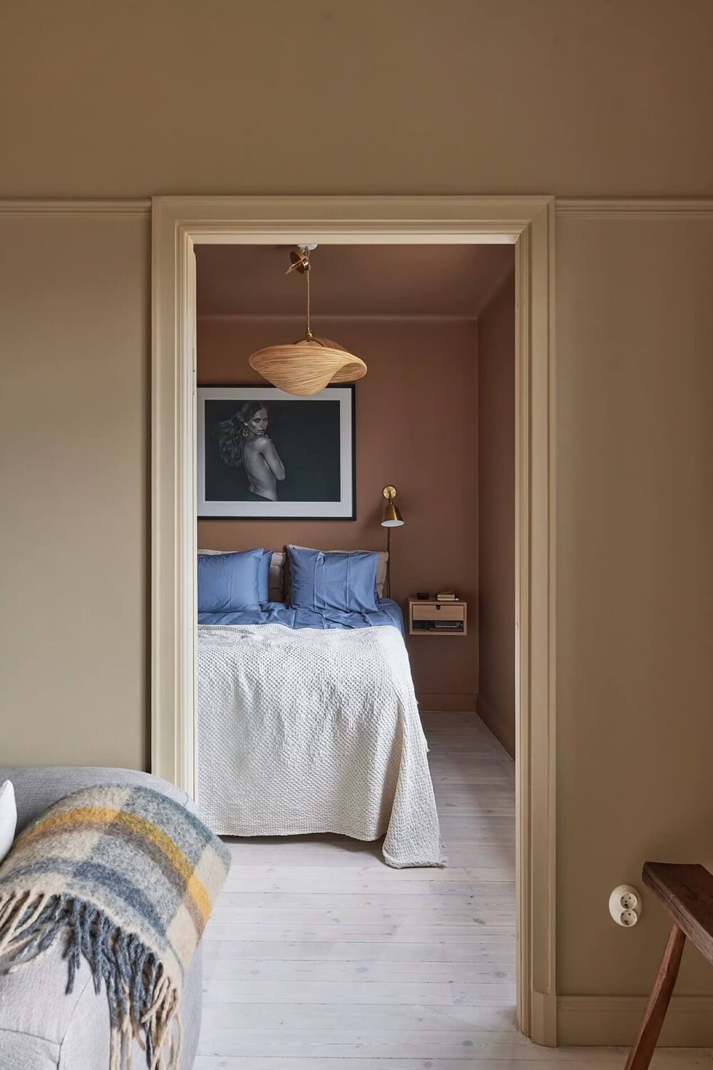 Warm Color-Drenched Rooms in a Swedish Apartment 16 view into bedroom