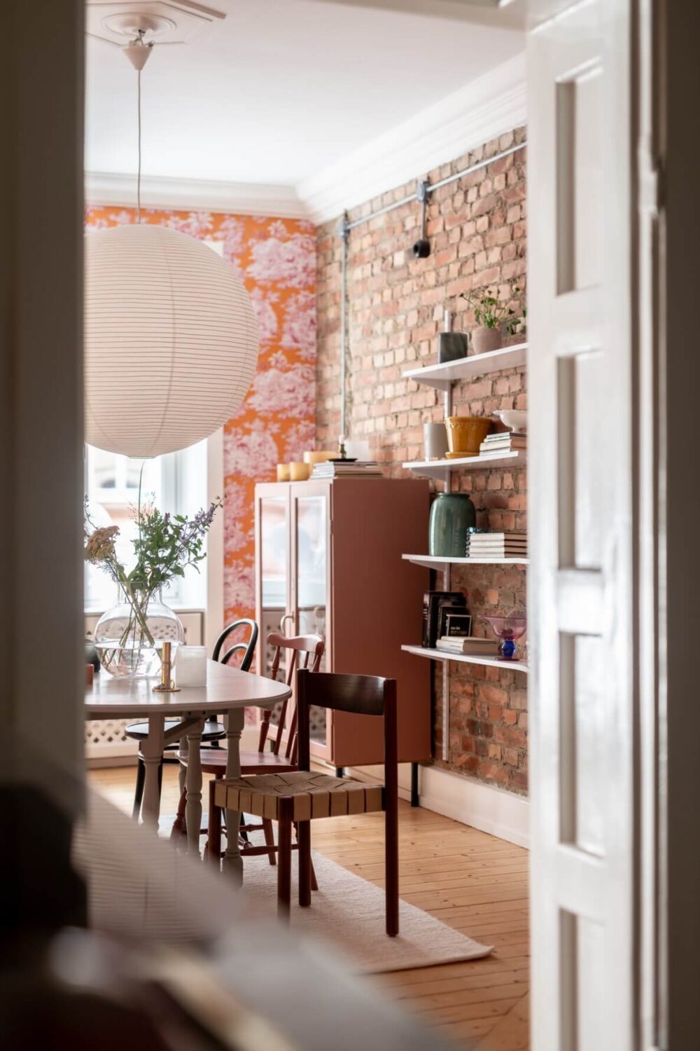 A Scandinavian Apartment with a Pale Yellow Living Room 13 view into dining room
