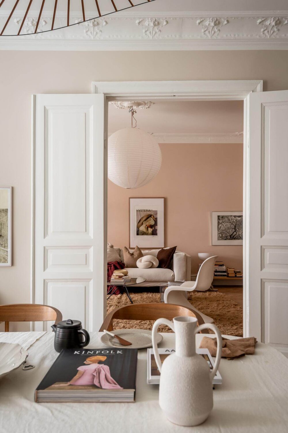 A Spacious Renovated Apartment with a Light Pink Living Room 8 view into living room from kitchen