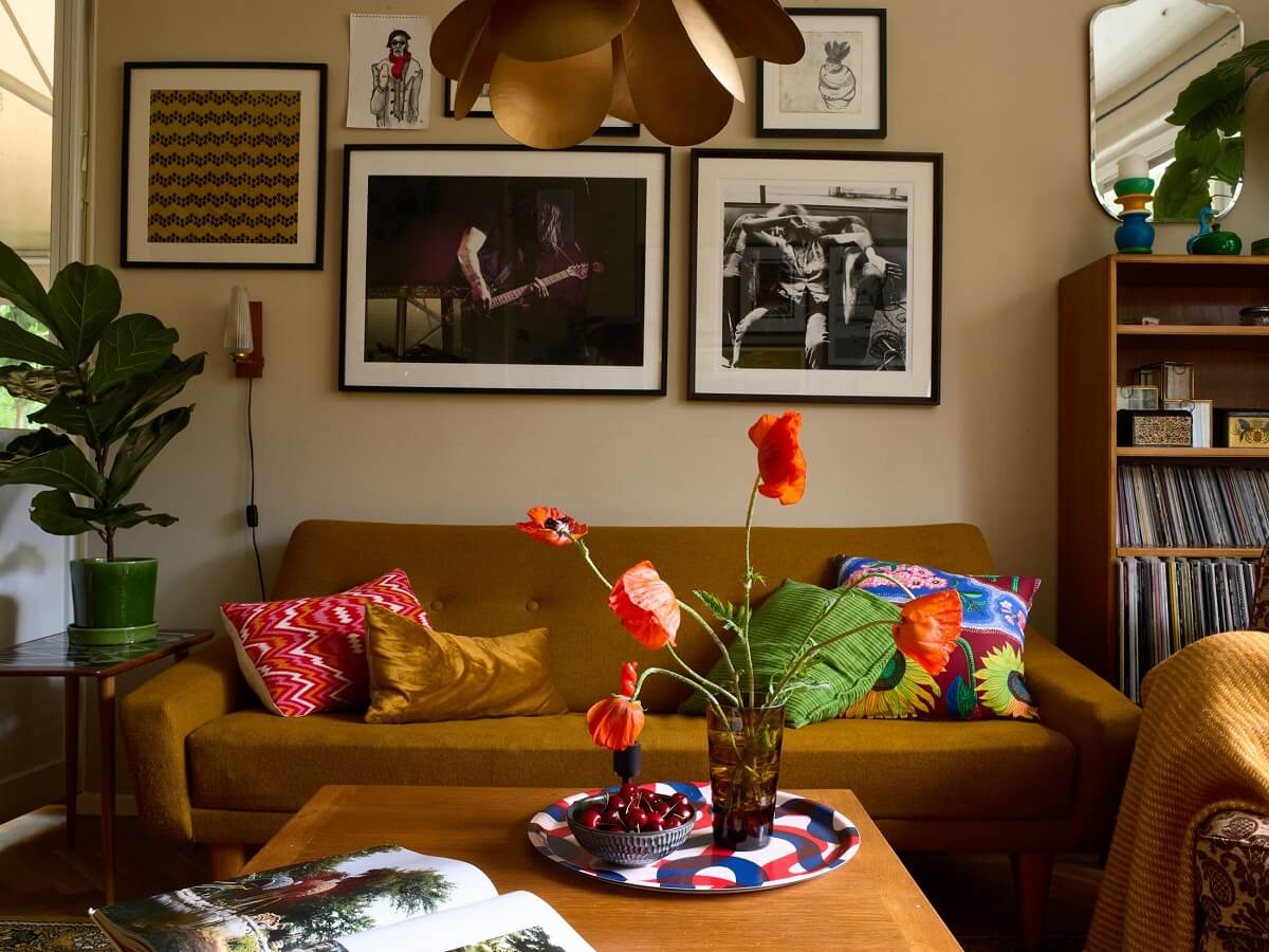 A Charming and Cozy Midcentury Family Apartment in Sweden 3 vintage living room green sofa nordroom