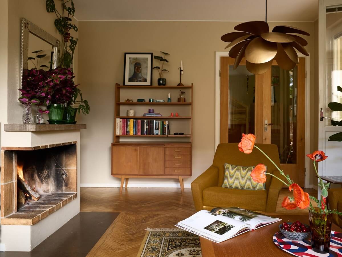 A Charming and Cozy Midcentury Family Apartment in Sweden 6 vintage living room with brick fireplace nordroom