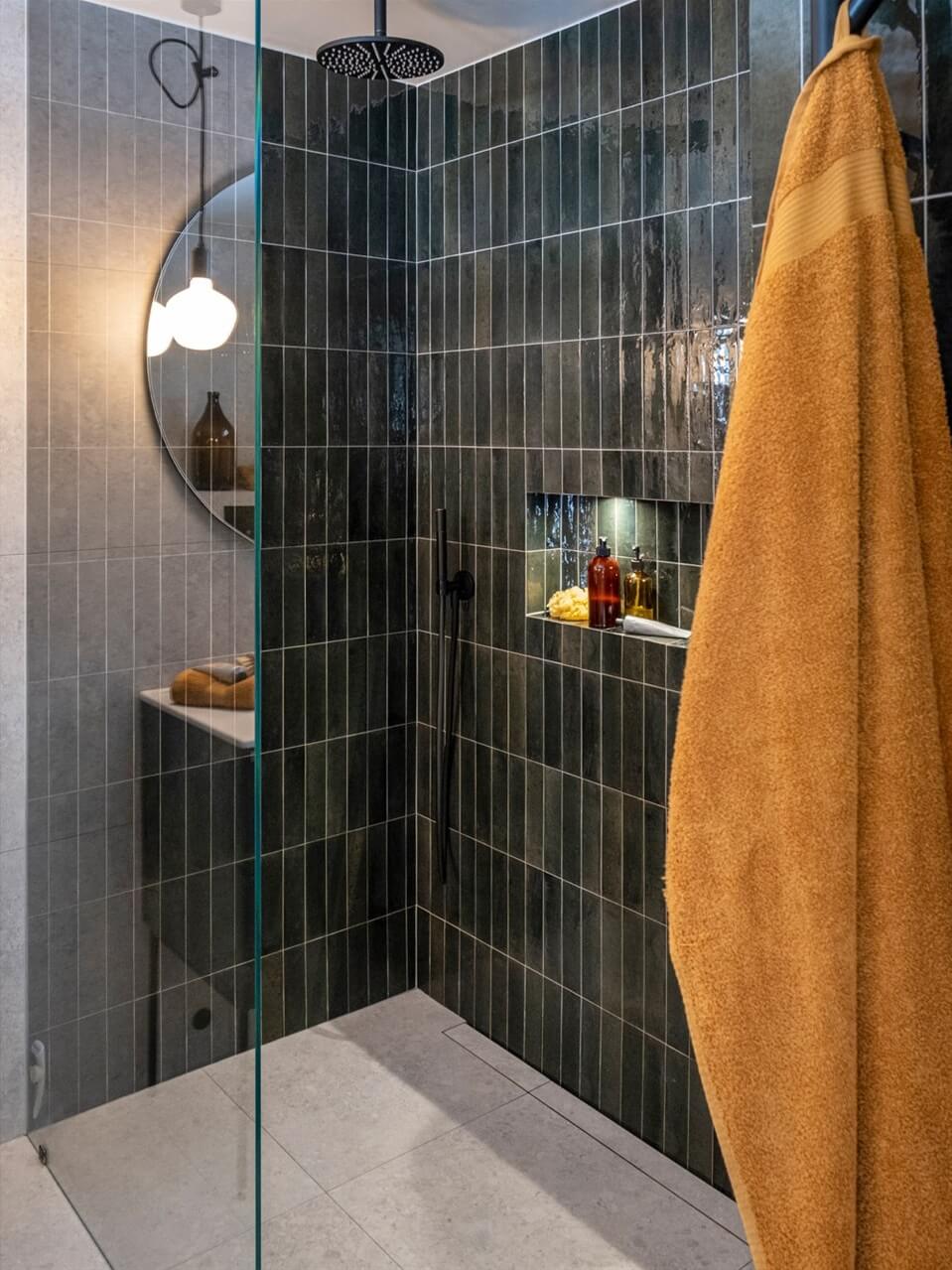 A White Swedish Villa with a Veranda and a Swimming Pool 24 walk in shower with dark green tiles nordroom