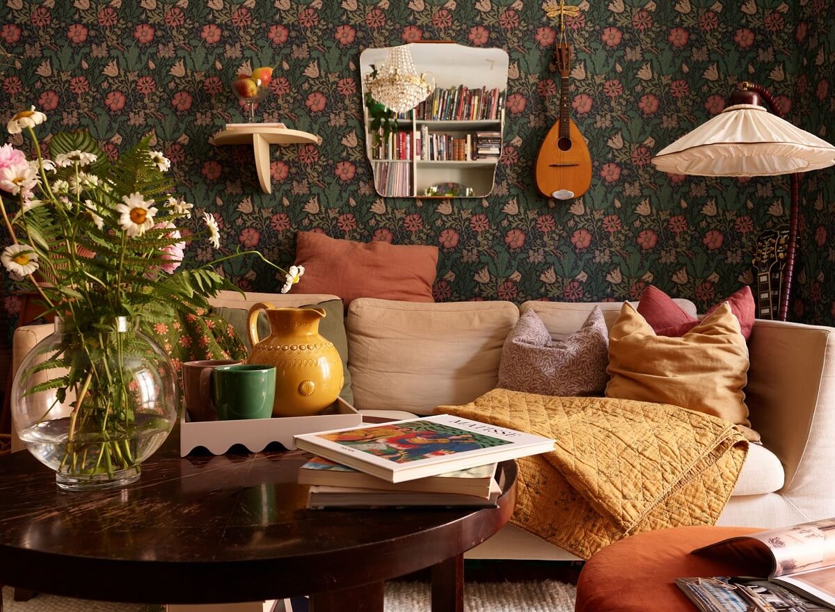 A Cozy 1920s Apartment with Original Details and Wallpaper 3 wallpaper living room with cozy textiles