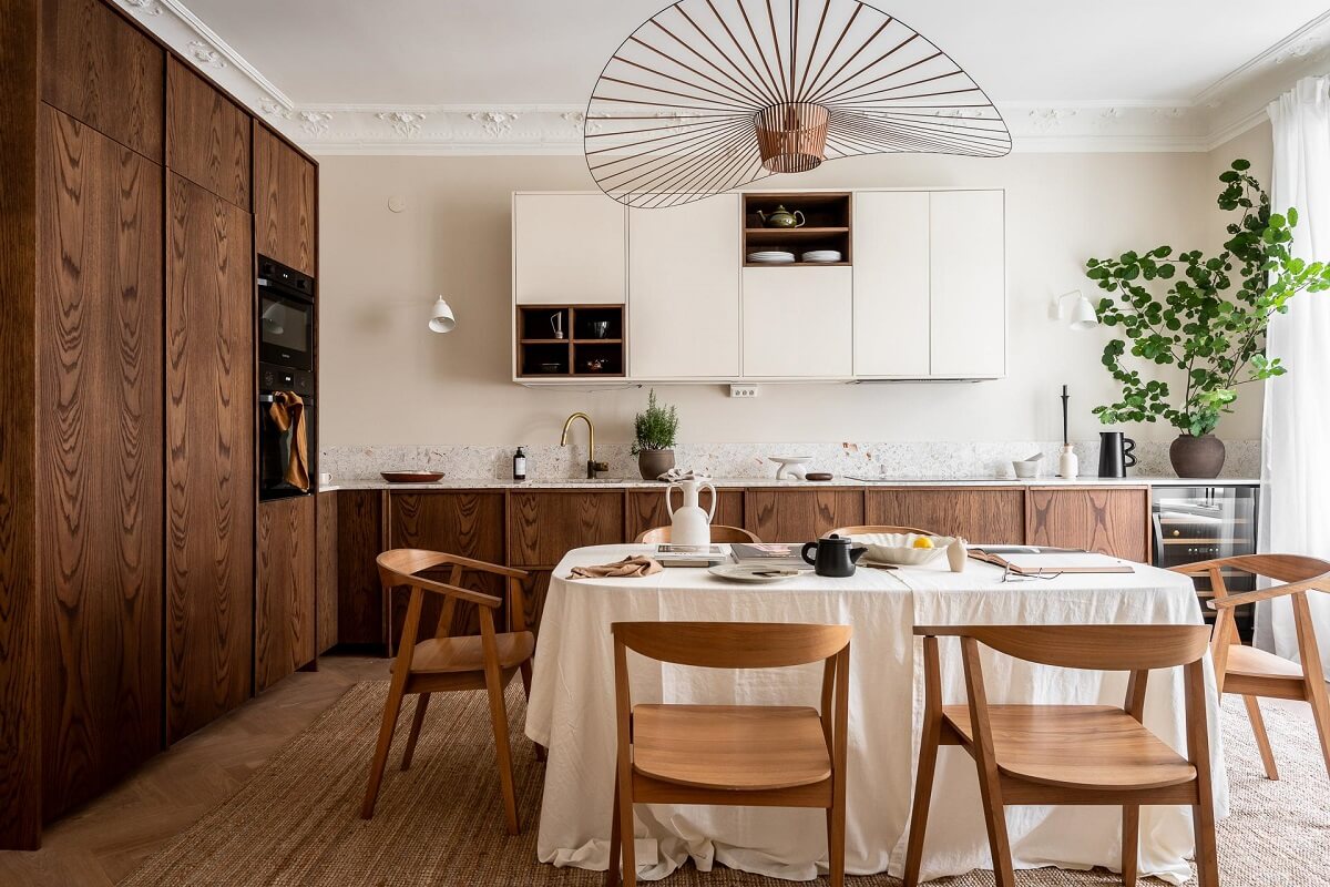 A Spacious Renovated Apartment with a Light Pink Living Room 10 walnut and white kitchen