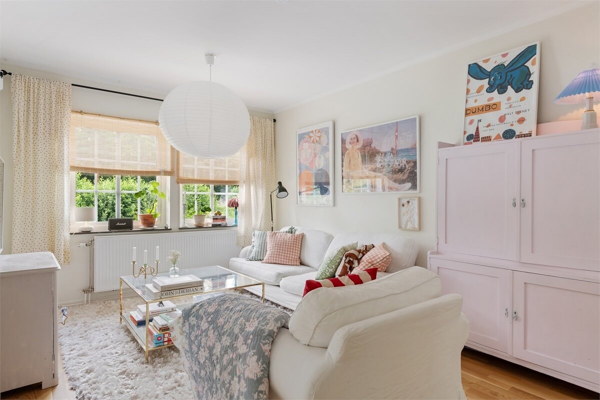 A Bright Open-Plan Swedish Home with a Pink Kitchen 20 white sitting room