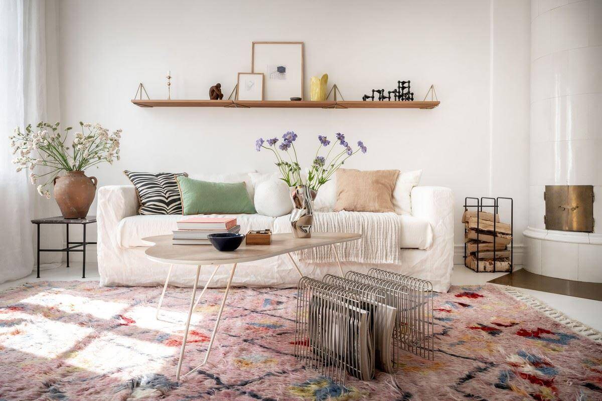 A Bright Swedish Apartment with Subtle Color Accents 6 white sofa with shelf living room