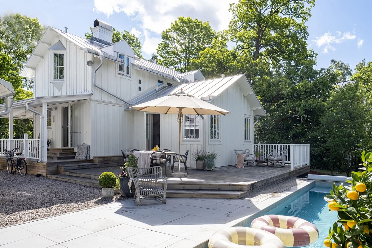 A White Swedish Villa with a Veranda and a Swimming Pool 26 white villa with swimming pool