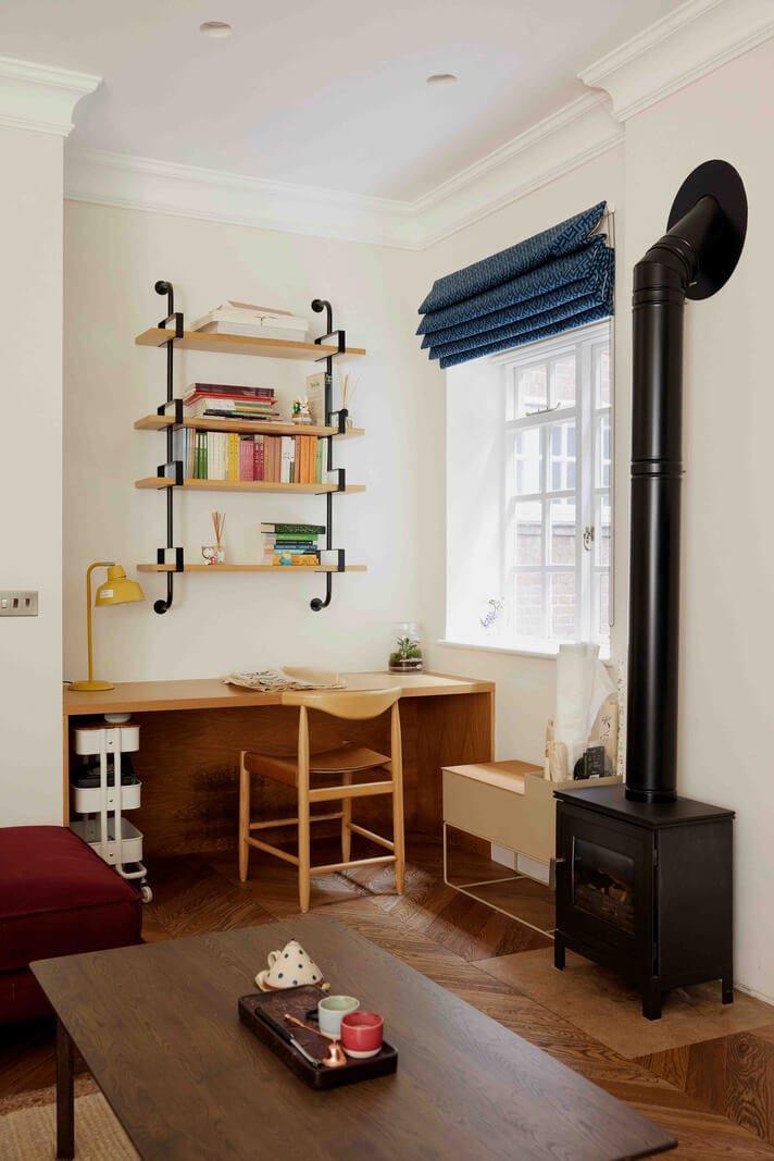 An Apartment with Rich Colors and Modern Design in a Victorian Mansion 5 wooden desk and wood burner living room nordroom