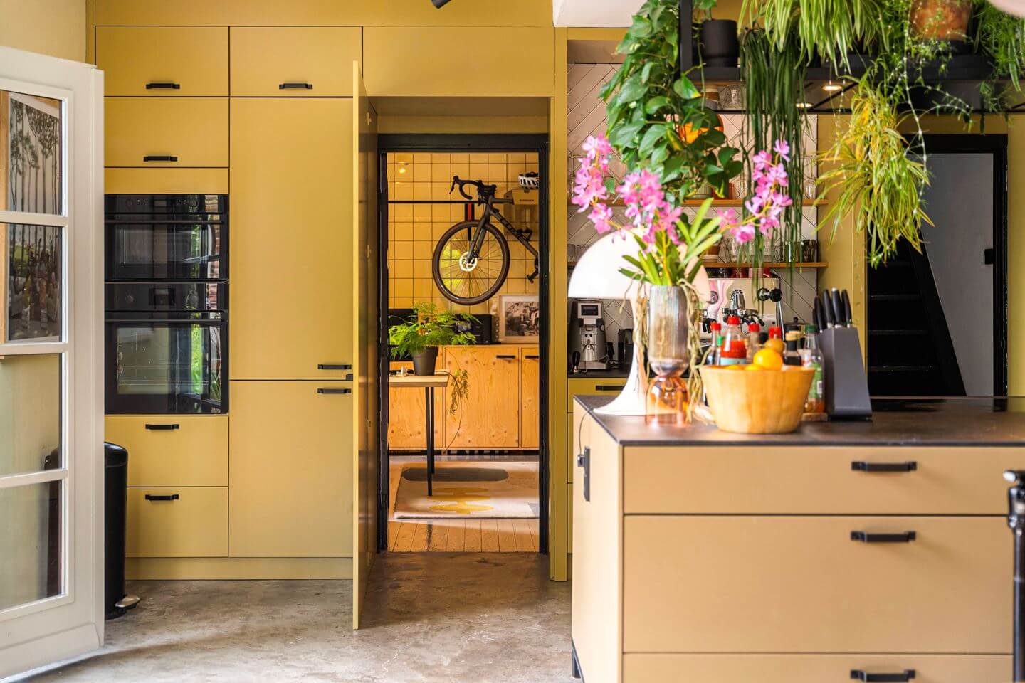An Old Smokehouse Transformed Into a Modern Industrial Home 15 yellow floor to ceiling cabinets