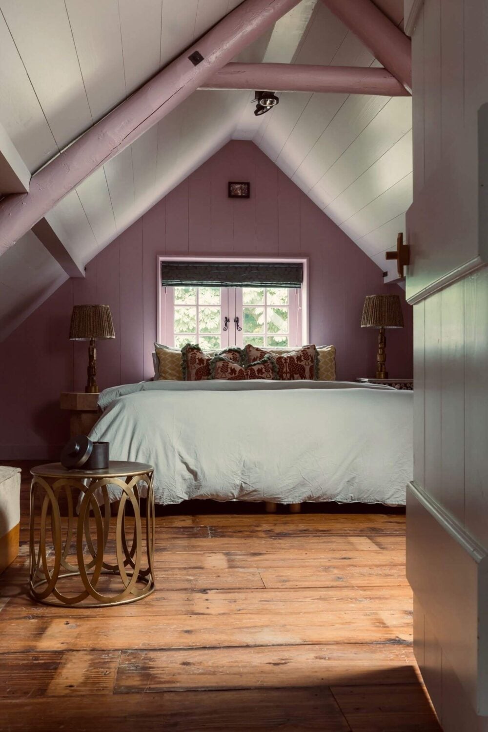 An Eclectic Colorful House in an Old Dutch Farmhouse 29 attic bedroom wooden floor purple accent wall