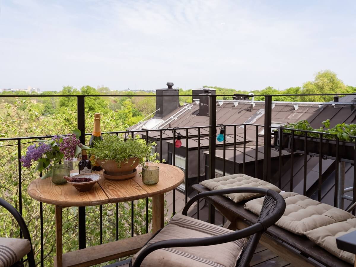 A Small Apartment with an Ochre Yellow Kitchen 7 balcony with treetop view