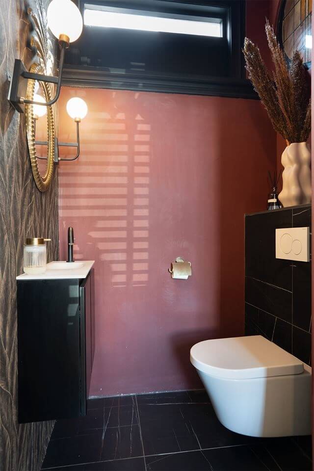 Rich Colors in a Charming Late 19th-Century Home in The Netherlands 14 bathroom black tiles and pink wall nordroom