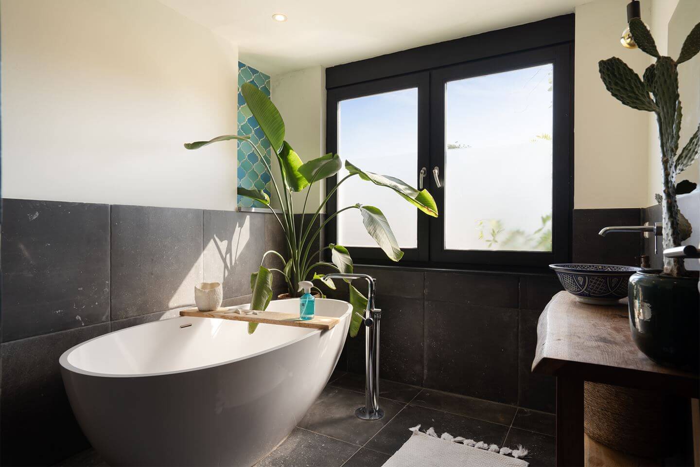 Rich Colors in a Charming Late 19th-Century Home in The Netherlands 20 bathroom black tiles freestanding bath