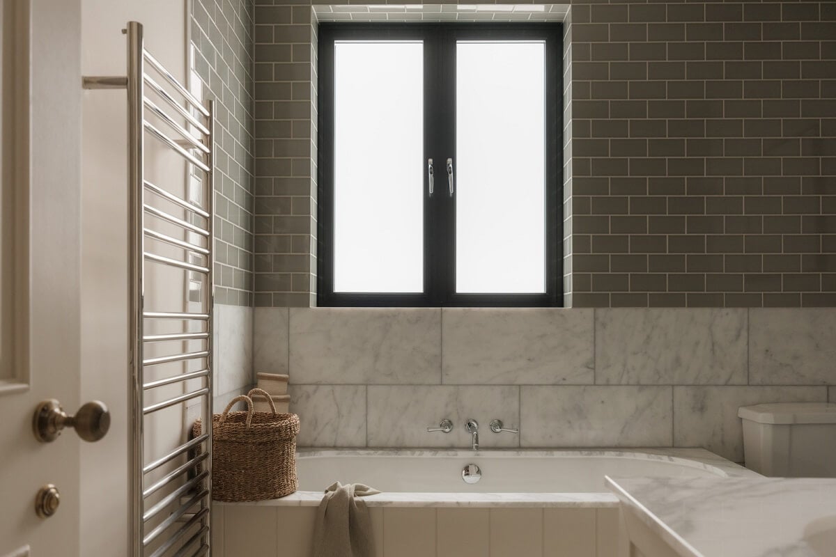A Calm Color Palette and Warm Materials in a London Home 22 bathroom marble and gray tiles