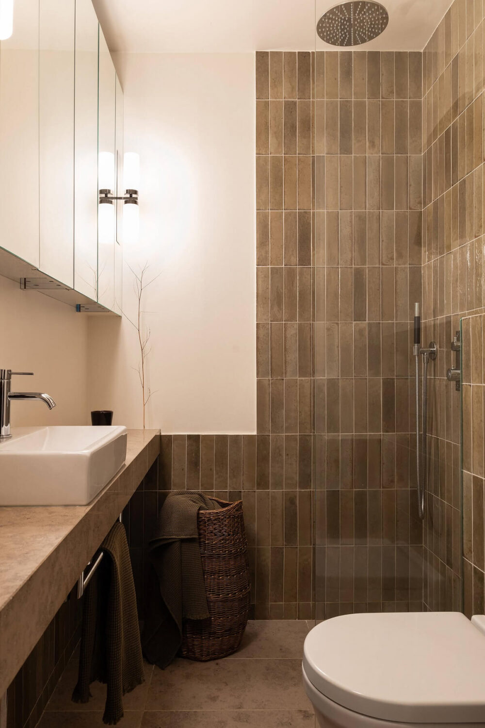 A Stylish Small Loft with Beautiful Natural Light 17 bathroom with muted green tiles A Stylish Small Loft with Beautiful Natural Light