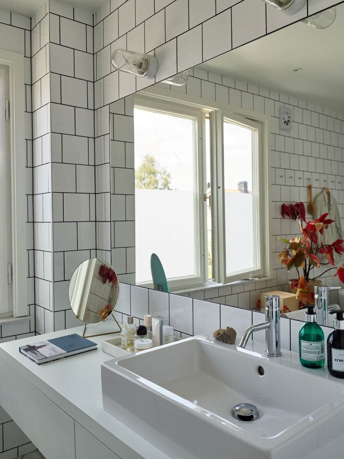 A 1940s House with Painted Floorboards in Sweden 20 bathroom with white tiles