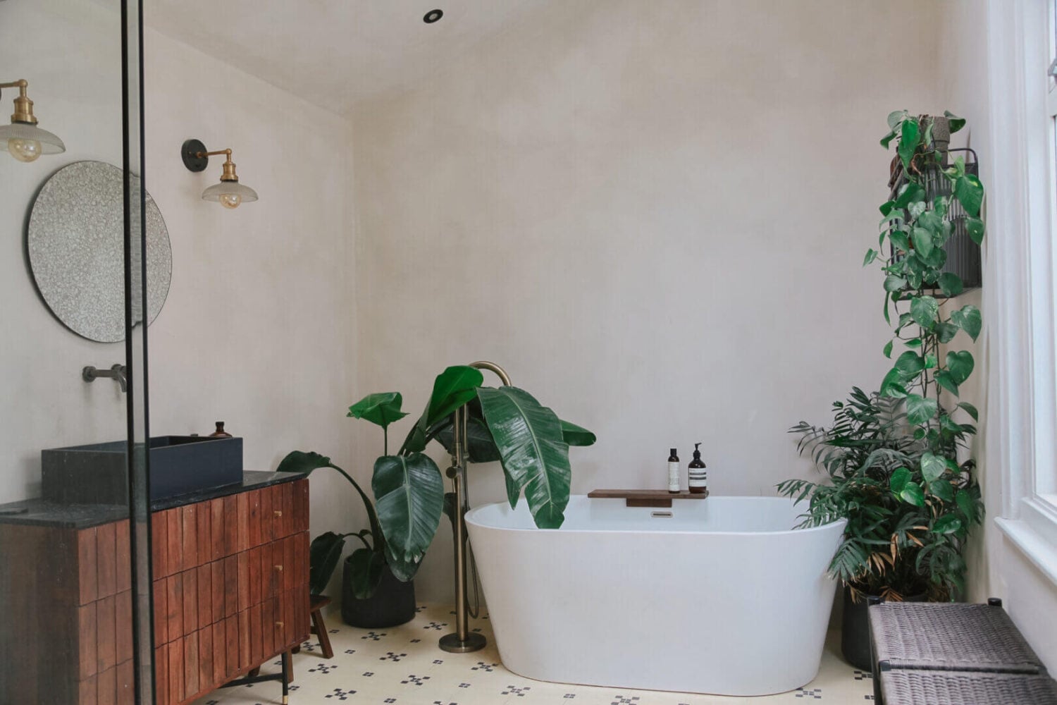 An English House with Carefully Restored Period Features 18 bathroom with wooden vanity freestanding bath and plants nordroom