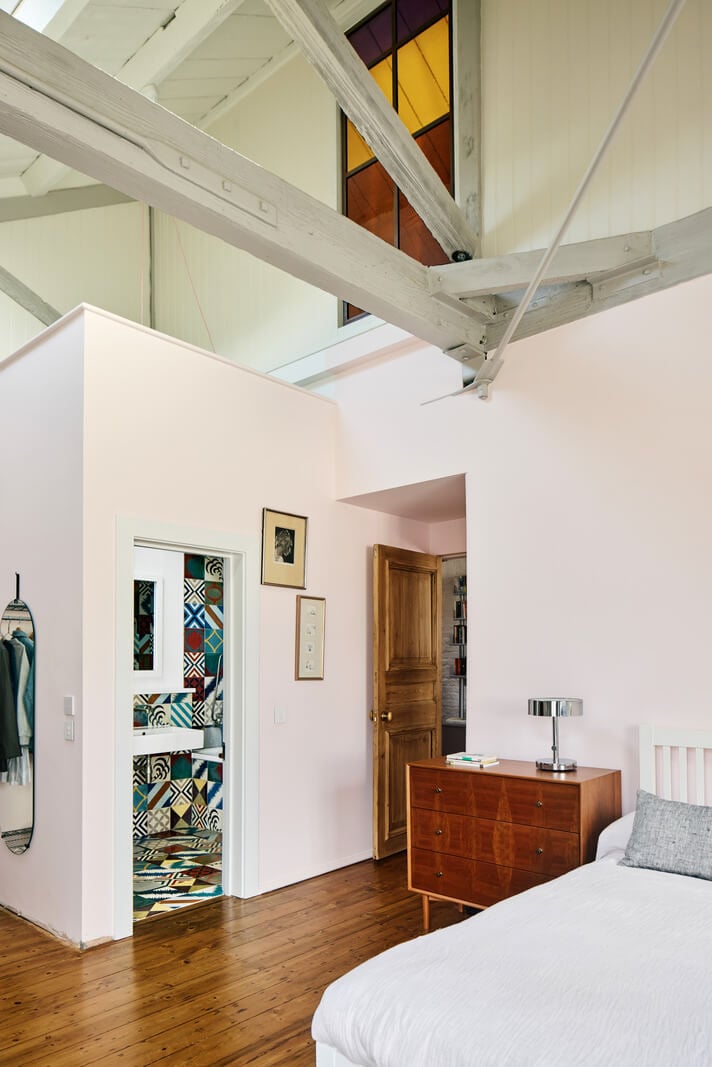 An Industrial and Colorful Warehouse Conversion in London 19 bedroom high pitched ceiling colorful en suite bathroom