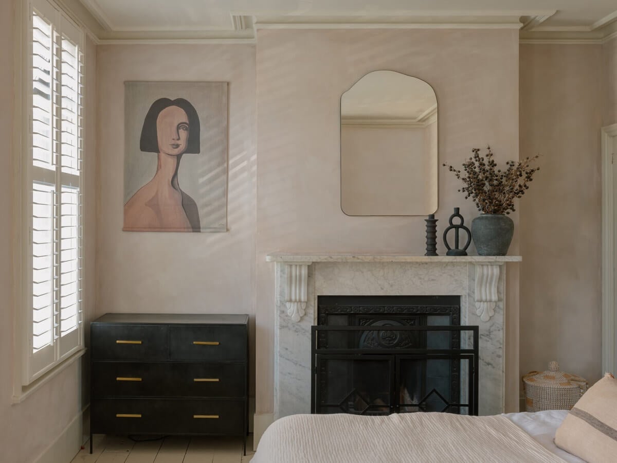 An English House with Carefully Restored Period Features 16 bedroom light pink plaster walls fireplace nordroom