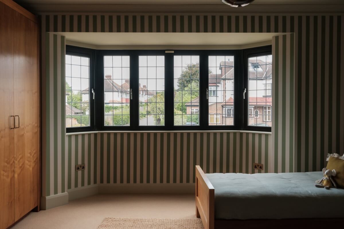 A Calm Color Palette and Warm Materials in a London Home 19 bedroom striped wallpaper bay window