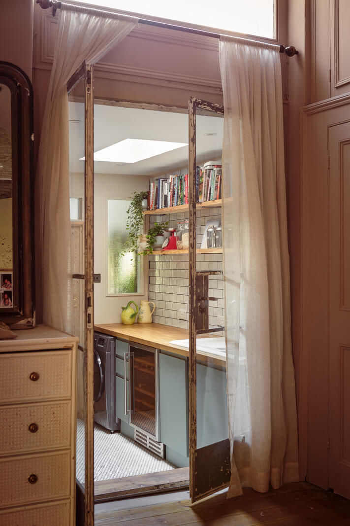 A Warm Ground Floor Apartment with Reclaimed Materials 12 bedroom view glass doors utility room