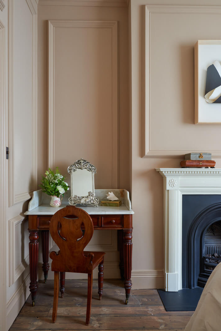 A Luxurious Two-Bedroom Maisonette in Primrose Hill 16 bedroom with antique vanity table and fireplace