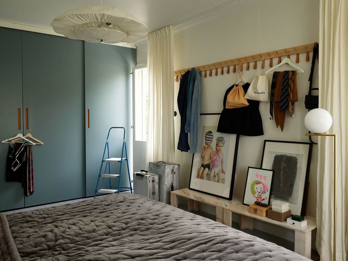 A 1940s House with Painted Floorboards in Sweden 15 bedroom with blue wardrobes