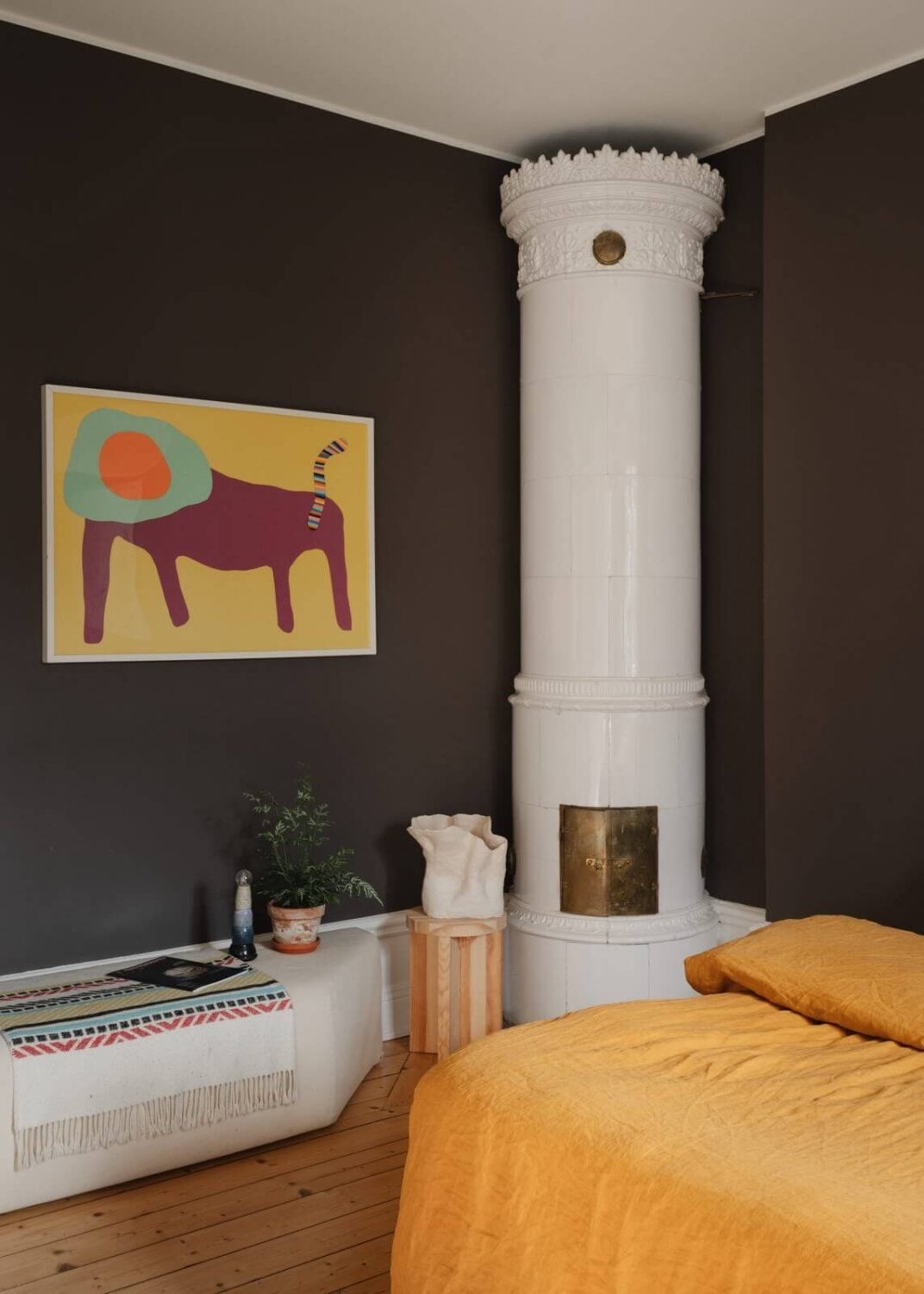 An Apartment with William Morris Wallpaper and a Dull Plum Bedroom 17 bedroom with dark plum walls fireplace and ochre yellow bedding nordroom