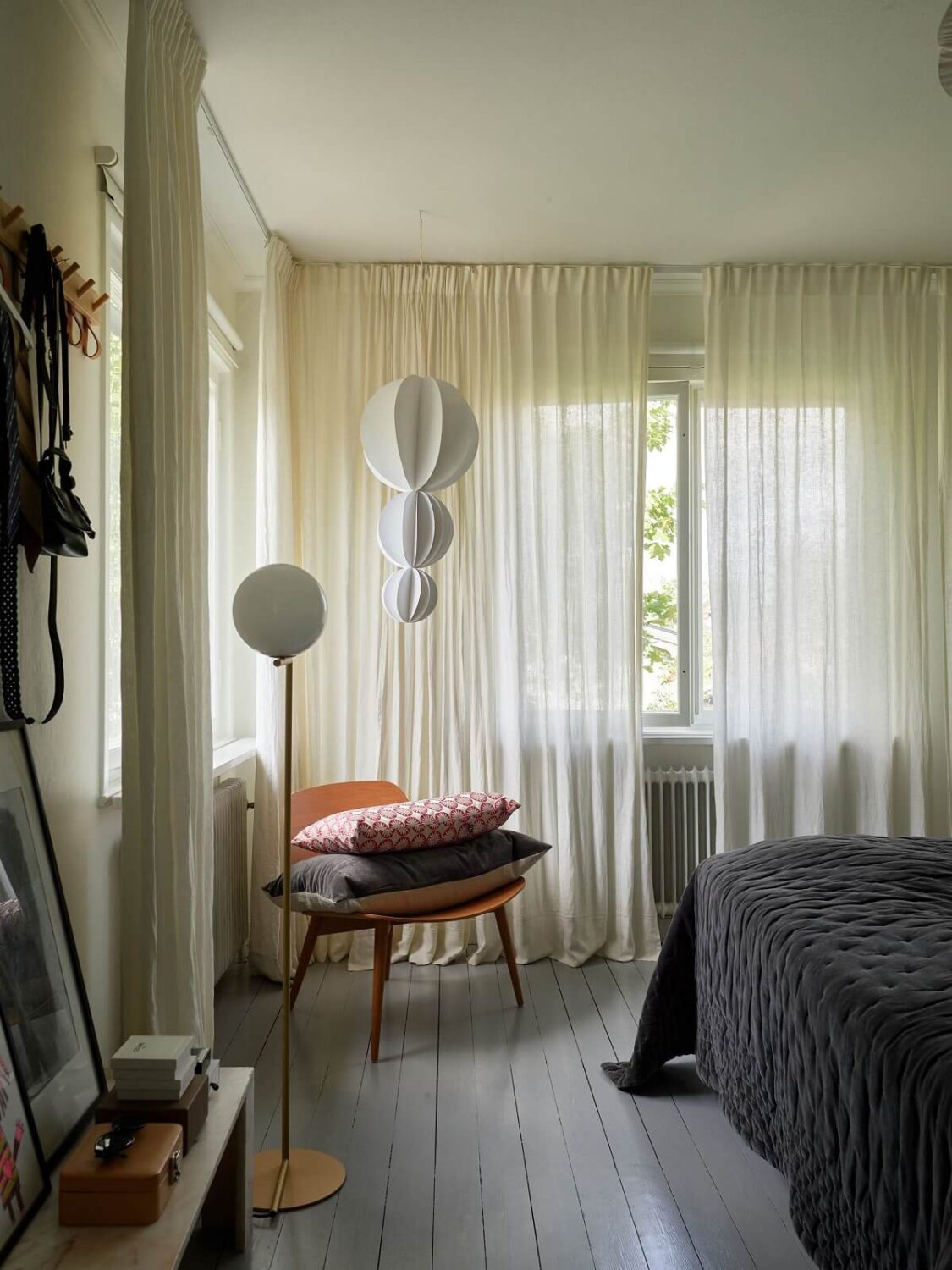 A 1940s House with Painted Floorboards in Sweden 14 bedroom with gray floorboards