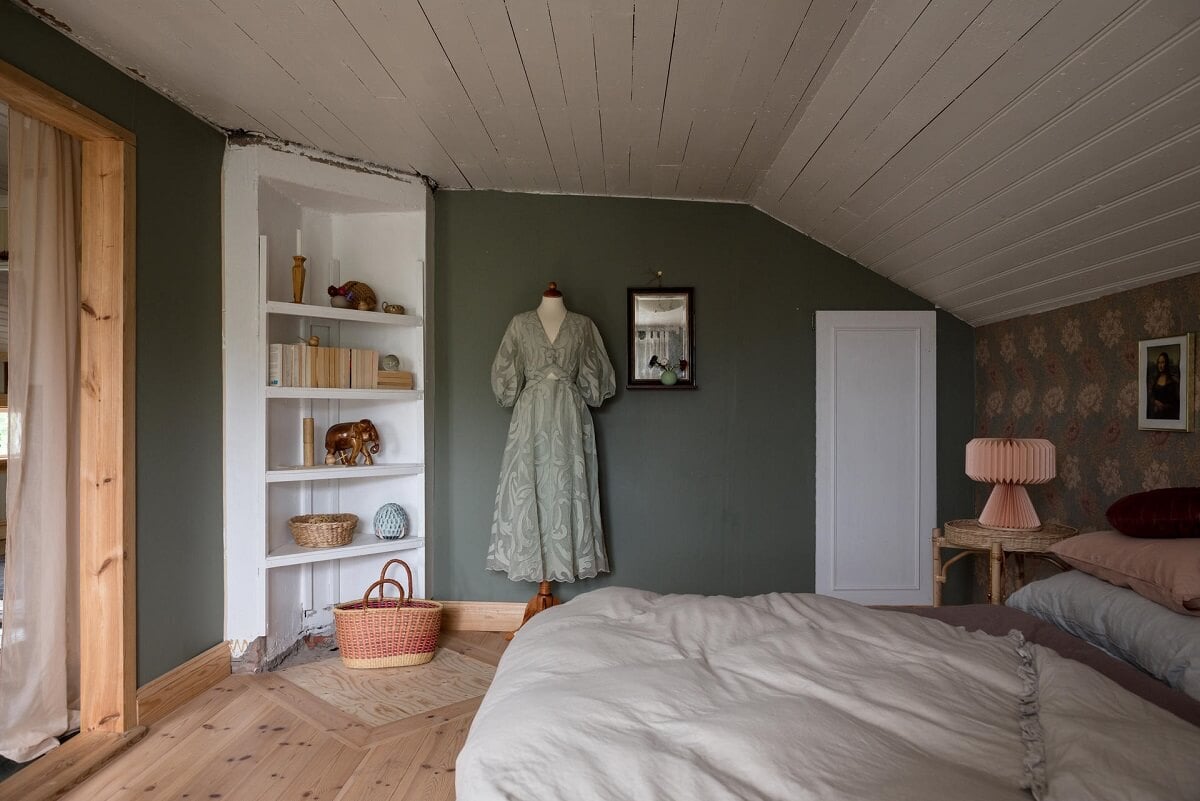 A Charming Country House with a Pink Dining Room and Wallpapers 22 bedroom with slanted ceiling wallpaper built in cabinet