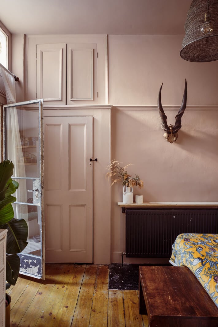 A Warm Ground Floor Apartment with Reclaimed Materials 15 bedroom with wooden floor