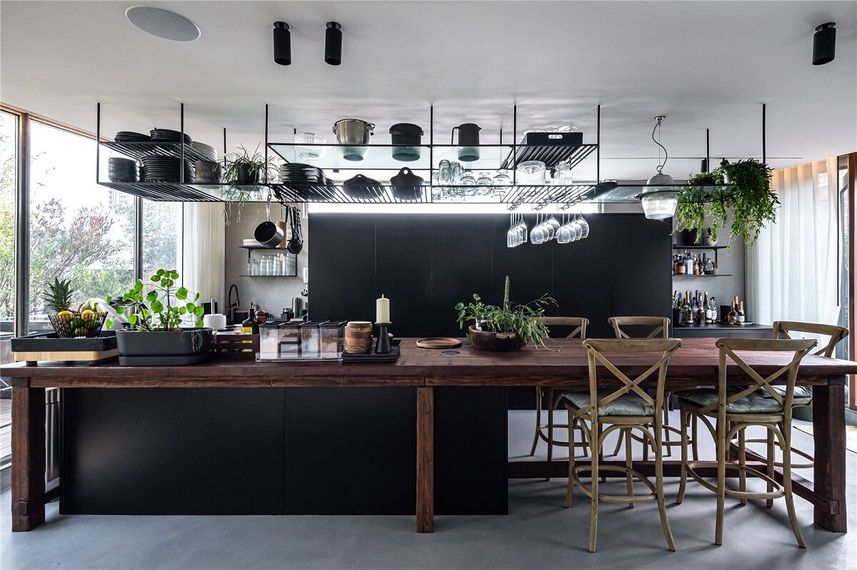 An Industrial, Loft-Style Duplex with Japanese Landscaped Roof Terraces 10 black and wood kitchen with open ceiling storage