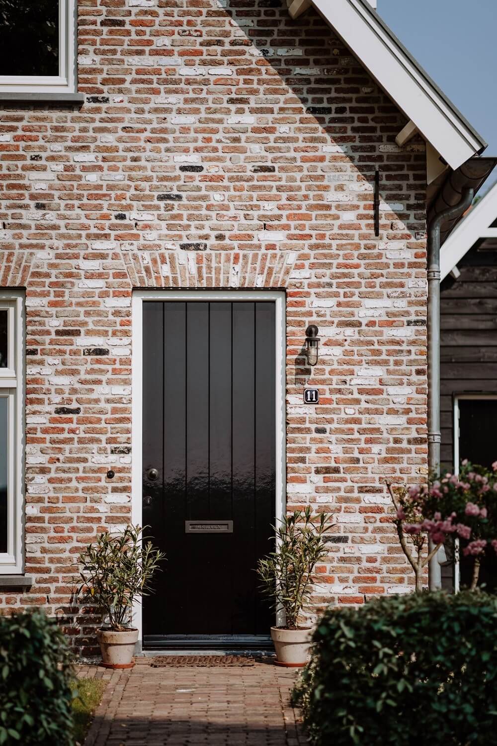 Historic Charm in a New Country House in The Netherlands 32 black front door 1 Historic Charm in a New Country House in The Netherlands