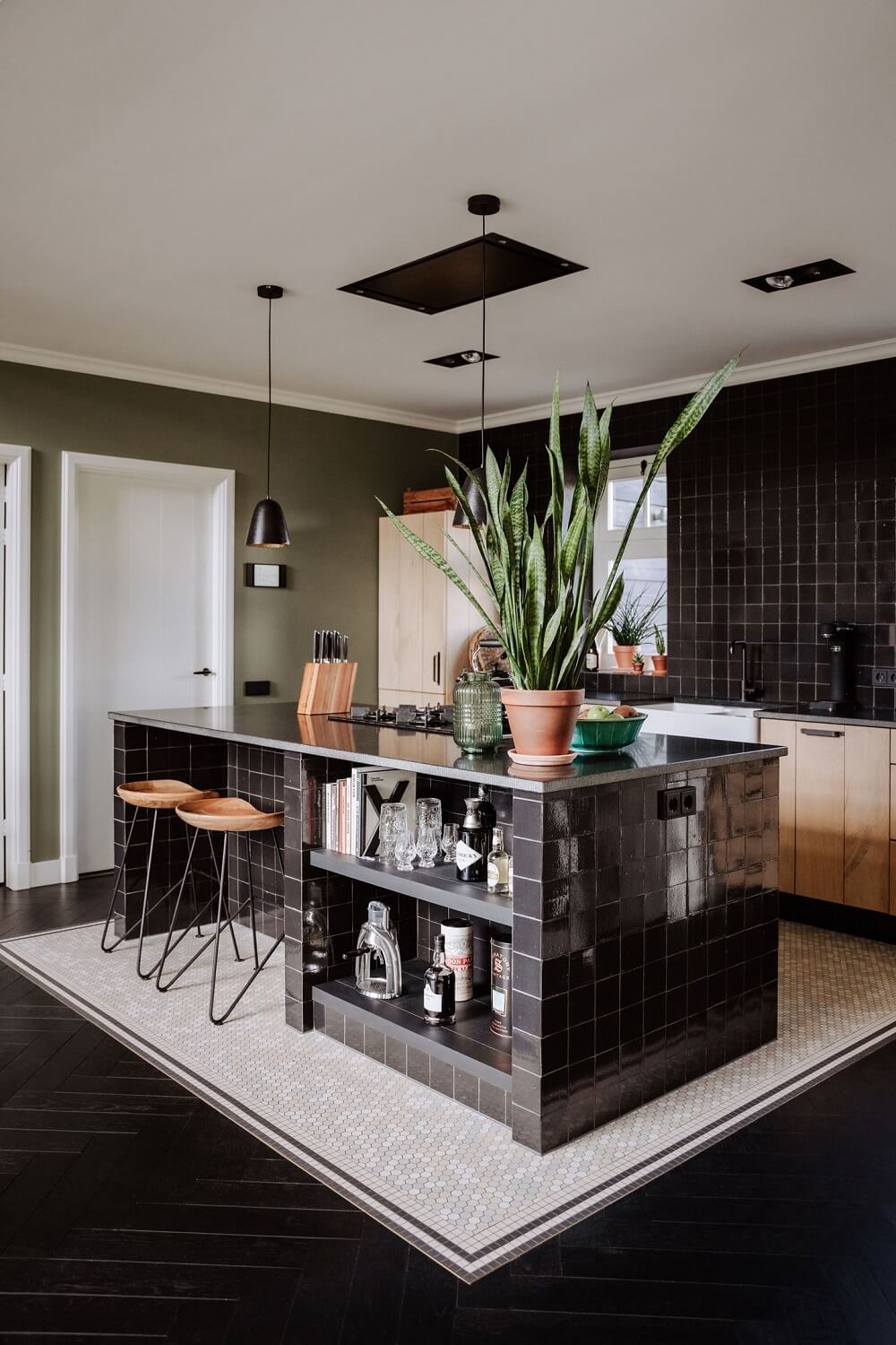 Historic Charm in a New Country House in The Netherlands 8 black kitchen island with bar stools