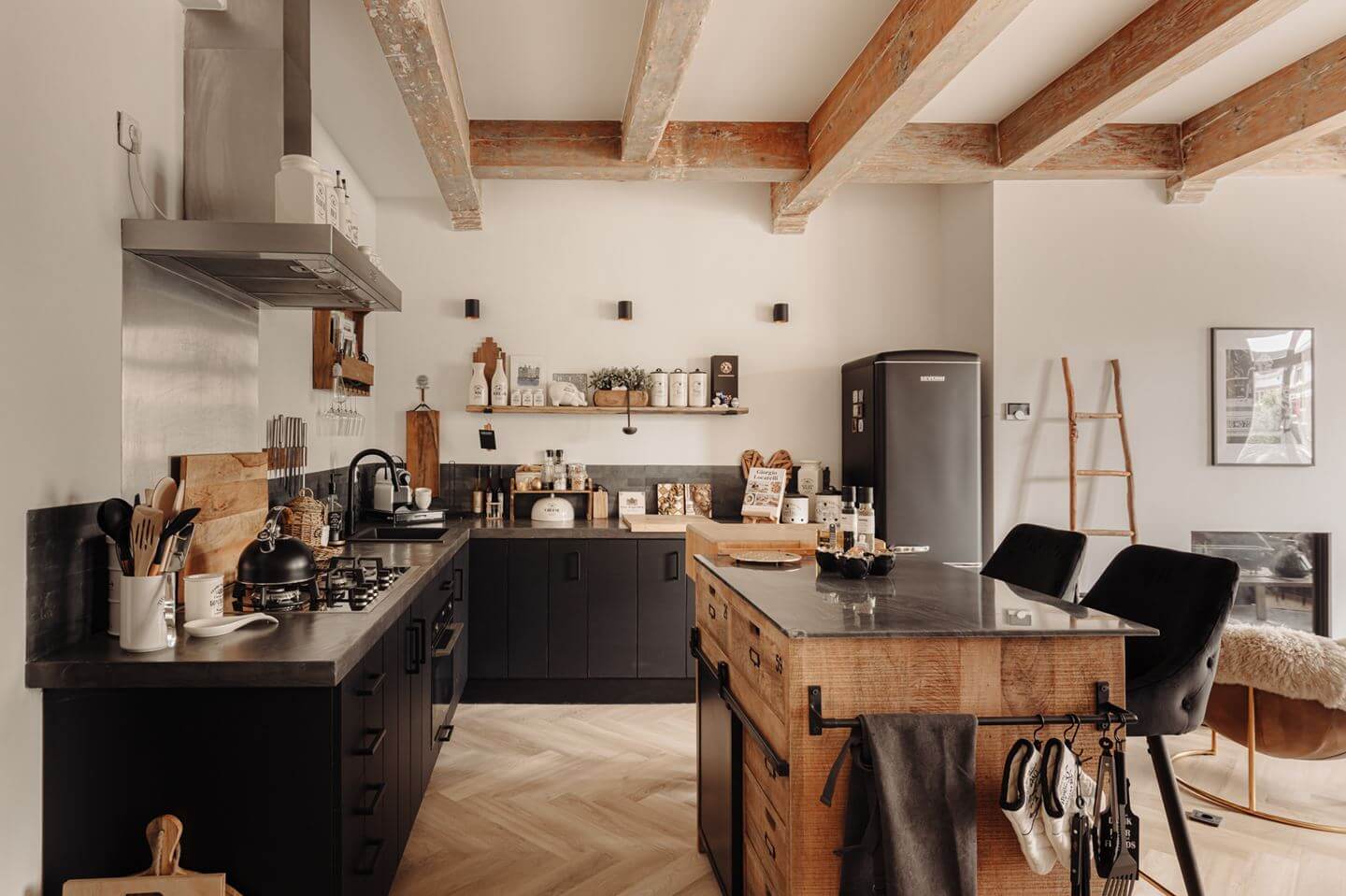A Charming Apartment in a Historic Canal House 7 black kitchen with island