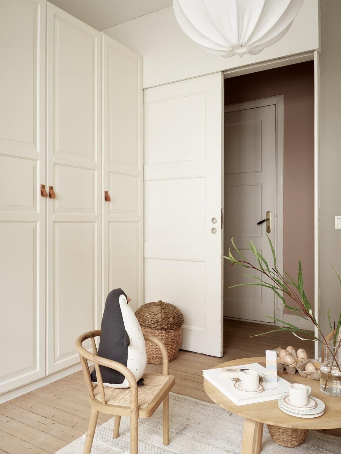 A Swedish Apartment with a Dark Blue Living Room and Exposed Brick 20 childrens room with wardrobe wall A Swedish Apartment with a Dark Blue Living Room and Exposed Brick