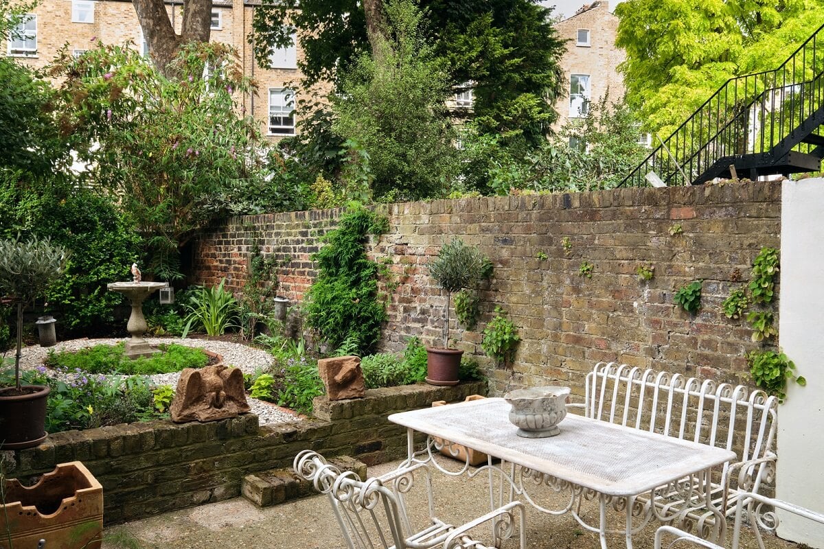 A One-Bedroom Maisonette with a Garden in London 16 city garden with brick wall