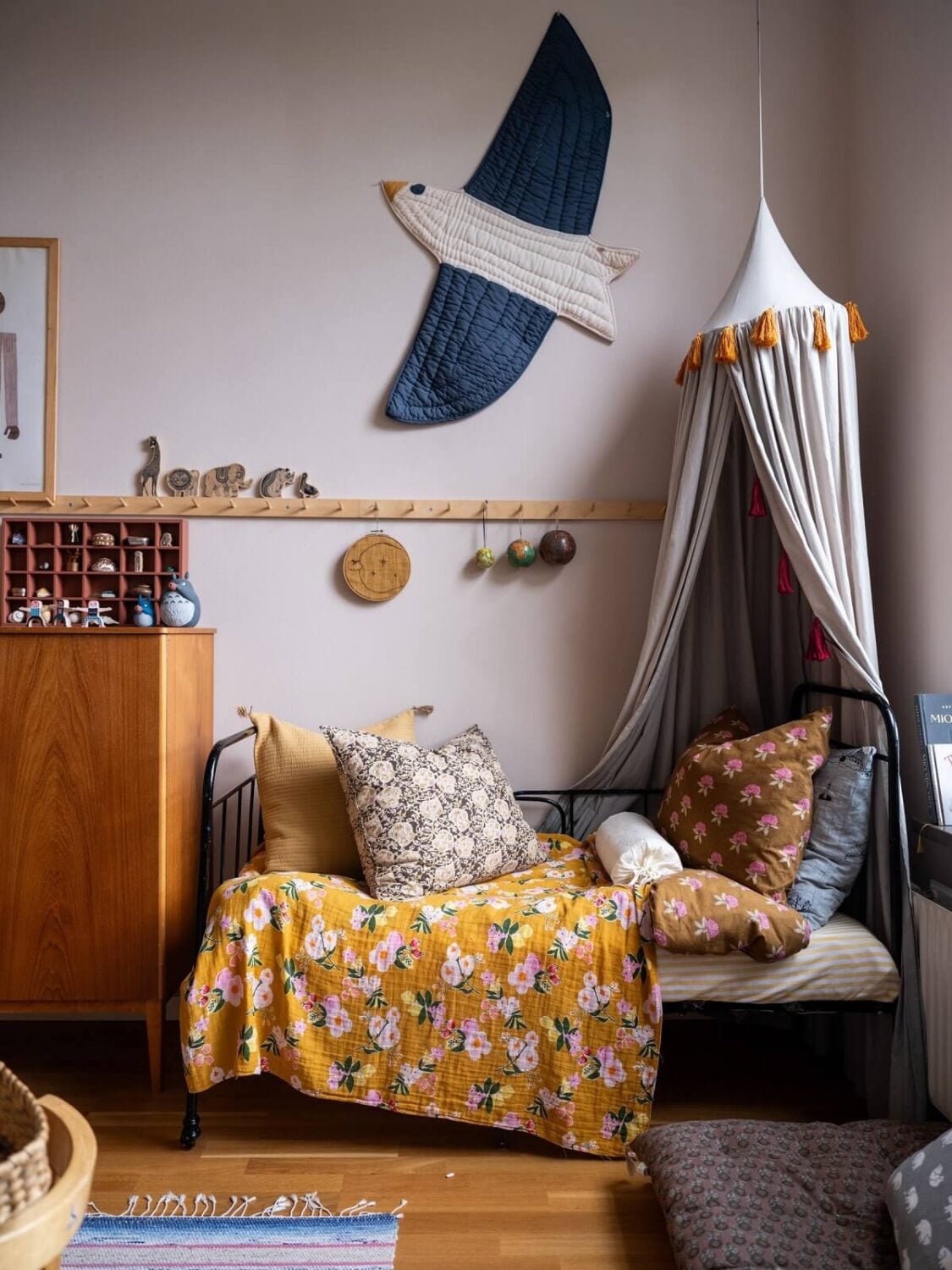 A Scandinavian Family Apartment with a Rusty Red Kitchen 22 cozy childrens room with canopy
