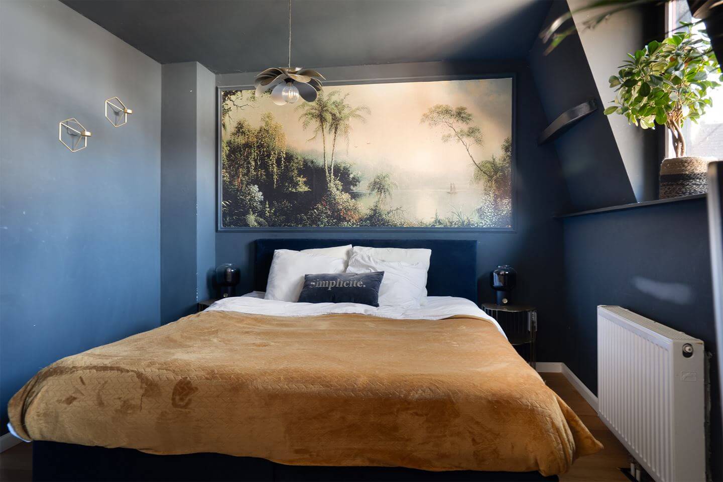 Rich Colors in a Charming Late 19th-Century Home in The Netherlands 17 dark blue color drenched bedroom ochre yellow bedding nordroom
