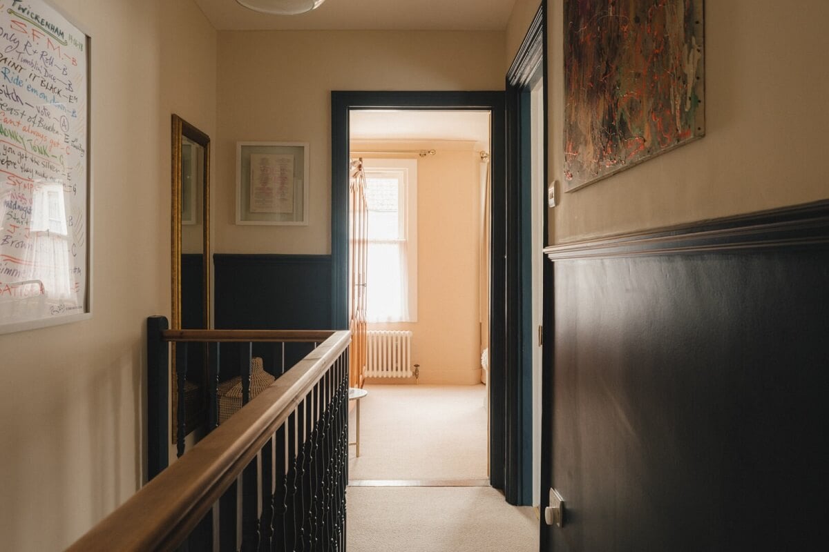 A Charming Victorian House with a Lovely Kitchen 11 dark blue wall paneling
