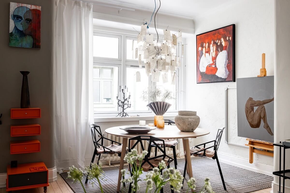 A Swedish Apartment with a Moody Kitchen and Bedroom 5 dining nook with round table and rt A Swedish Apartment with a Moody Kitchen and Bedroom