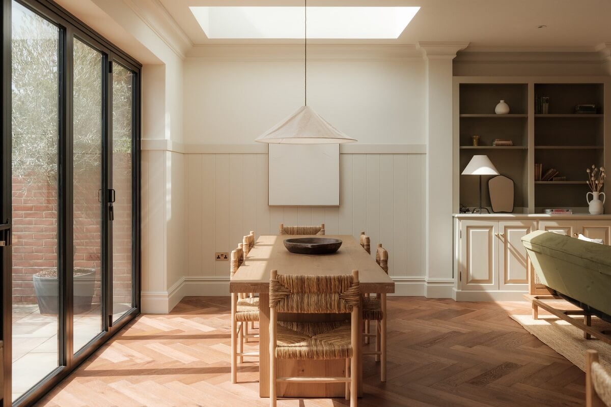 A Calm Color Palette and Warm Materials in a London Home 13 dining table under skylight